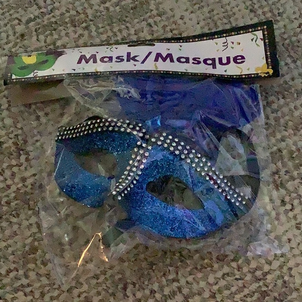 Blue sparkle mask for Halloween or a masquerade party has Stones blue